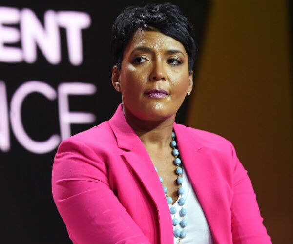 atlanta mayor keisha lance bottoms is s hown in a fuschia blazer, white bouse and powder blue neckpace