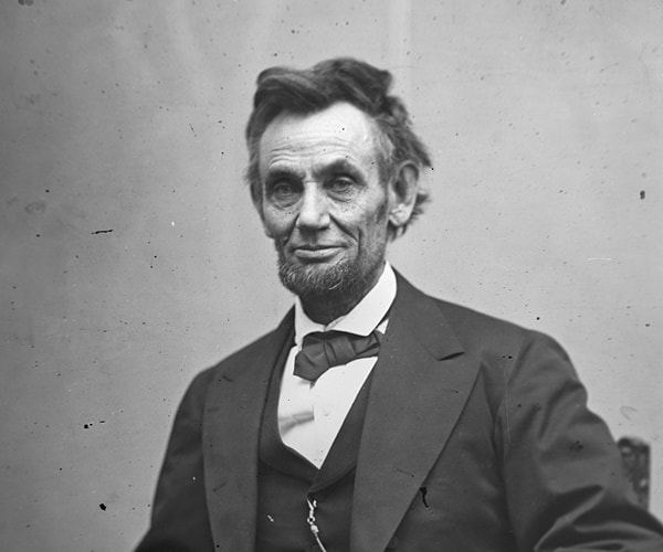 a picture of abraham lincoln duirng a sitting for a portrait