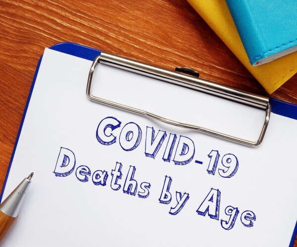 clipboard with paper titled "COVID deaths by age"