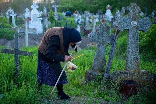 Romanian Villagers Light Graveyard Fires in Easter Ritual