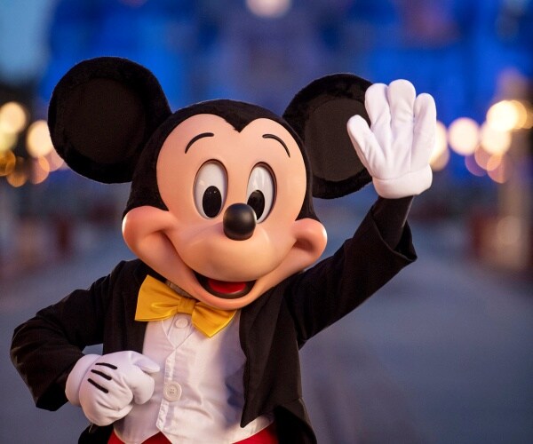 mickey mouse waves at disney world