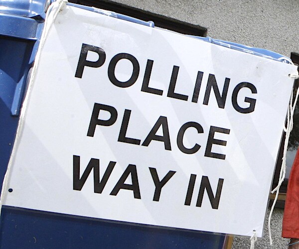a placard reads polling place way in