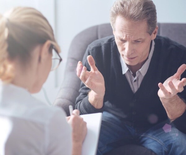 man talking to therapist