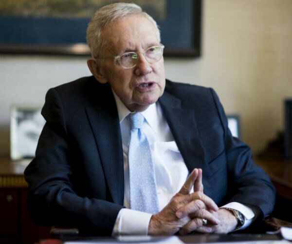 harry reid is shown during an interview
