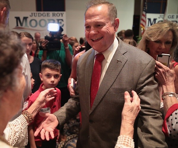 Moore Supporters Imply Conspiracy, Ignore His Creepy Denials