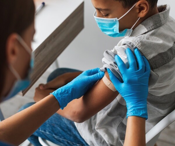 young boy getting a vaccine