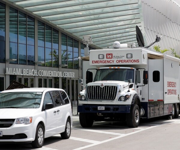 emergency operations truck parked outside miami convention center 