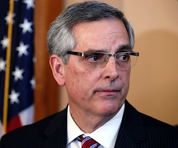 Georgia Secretary of State Brad Raffensperger speaks to the media