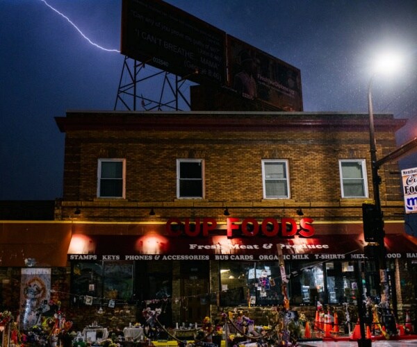 The entrance of Cup Foods in a thunderstorm