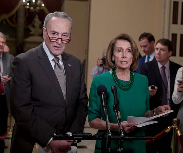 senate minority leader chuck schumer and house speaker nancy pelosi speak during a news conference on capitol hill