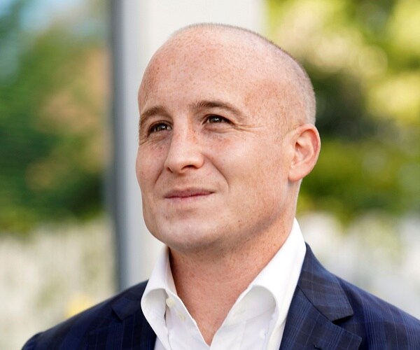 max rose stands outside