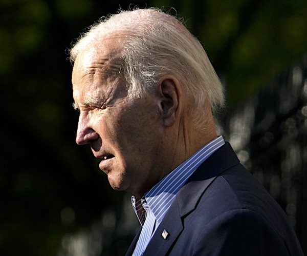 President Joe Biden looks on