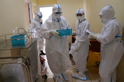 Rapid Virus Spread through Indonesia Taxes Health Workers