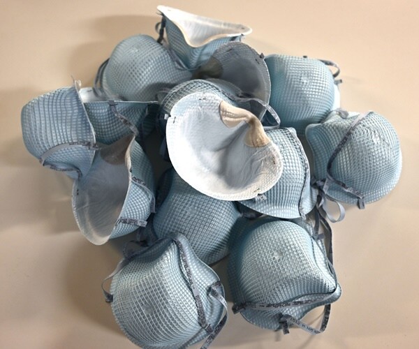 used N-95 masks pile up after us.