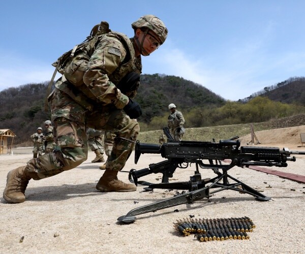 soldier in camouflage conducting an exercise