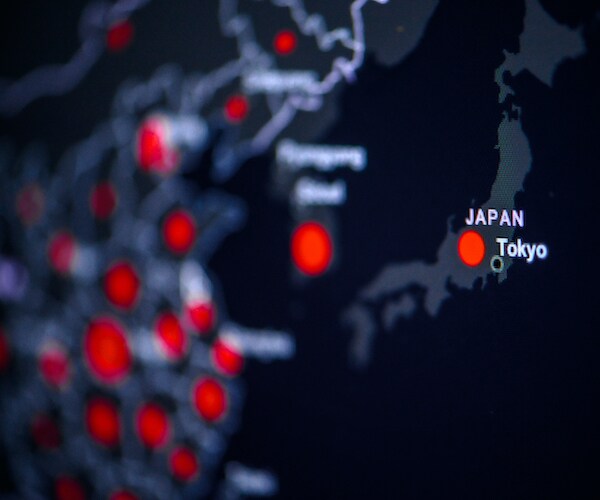 a map of japan with red dots demarking coronavirus impact area
