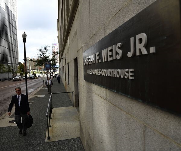 Synagogue Massacre Defendant Appears in Court in Wheelchair