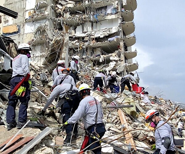 crews search the surfside condo collapse site for survivors or victims almost a week after the tragedy