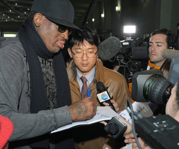 dennis rodman signs an autograph at north koreas pyongyang international airport in 2013