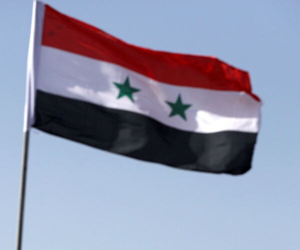 the syrian flag flying