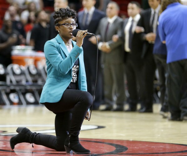 Anthem Singer at Heat-76ers Game Kneels During Performance