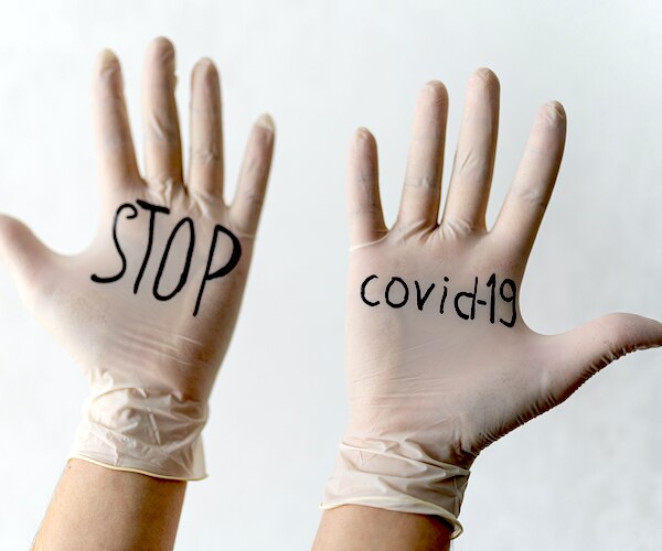 surgical gloves are marked stop covid-19