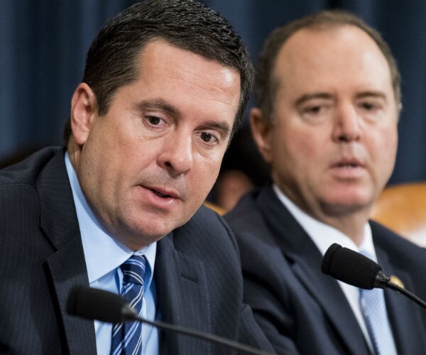 devin nunes is shown sitting next to adam schiff
