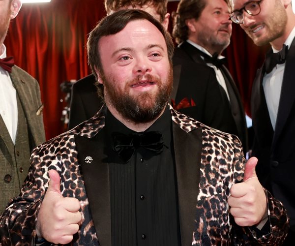 James Martin holds thumbs up on the red carpet