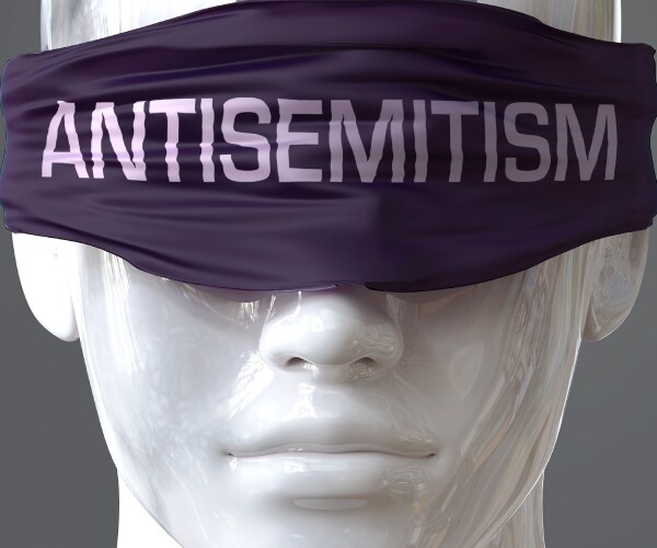 a mannequin head wearing a blindfold with antisemitism written on it