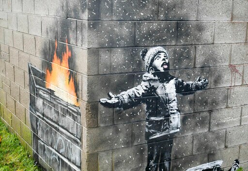 Banksy Mural on Garage in Wales Sold but Will Stay in Place