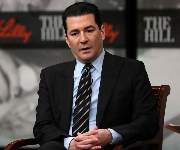 scott gottlieb speaks while sitting onstage