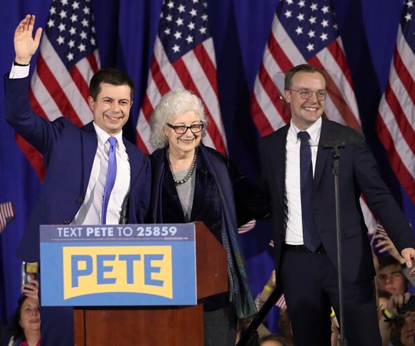 pete buttigieg with his mother and husband the night of the nh primary
