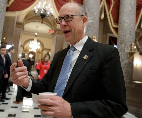 oregon republican greg walden addresses the media, holding a cup of coffee