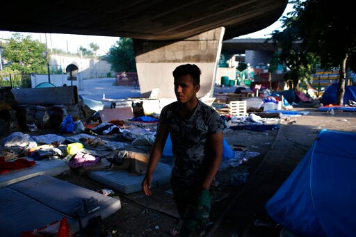 The Latest:  EU Official: UN Sanctions for Migrant Smugglers