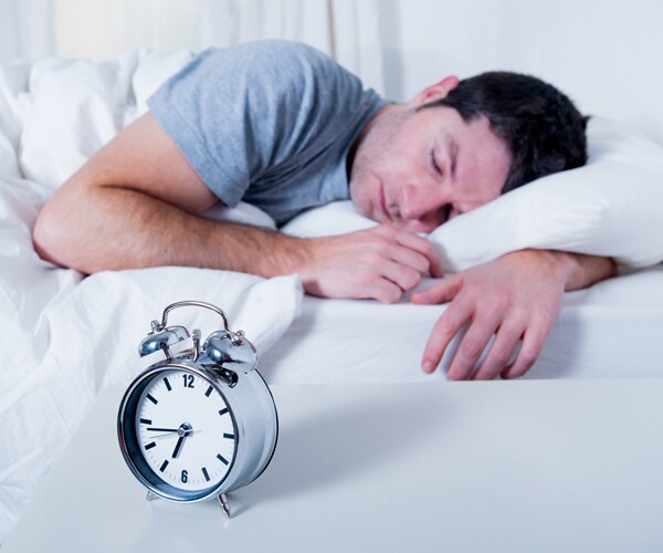 a man sleeping in bed