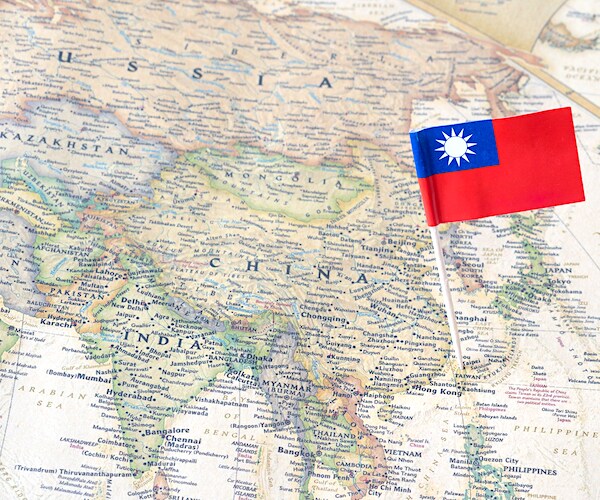 a map of china and taiwan marked by a pin drop of the taiwan flag