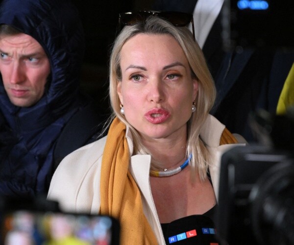 marina ovsyannikova speaks to the media