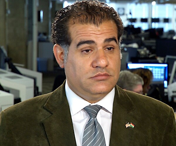 Kurdish journalist Rahim Rashidi speaks on television about his people in syria