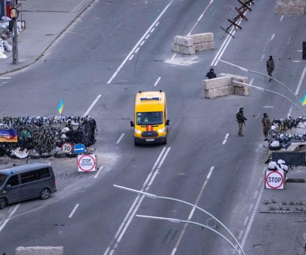 Ukrainian servicemen stand guard