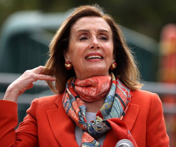 pelosi runs her fingers through her hair