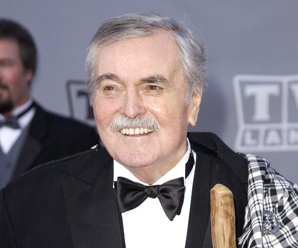 james doohan stands on red carpet
