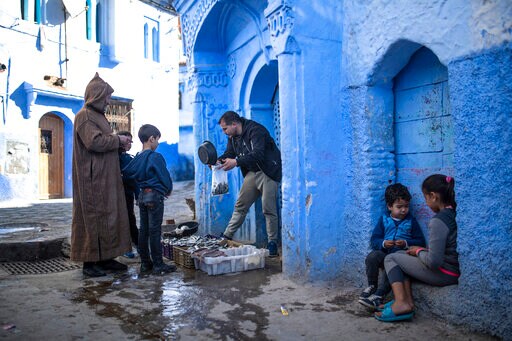 AP PHOTOS: Pandemic Empties Blue-hued Moroccan Tourist Town