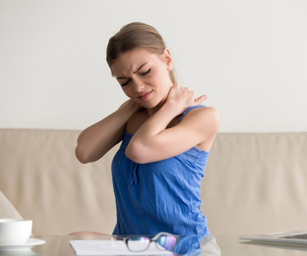 a woman with a stiff neck