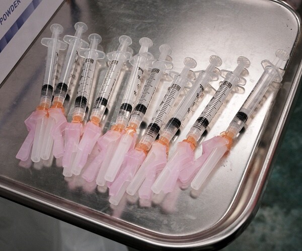 needles lay on silver tray