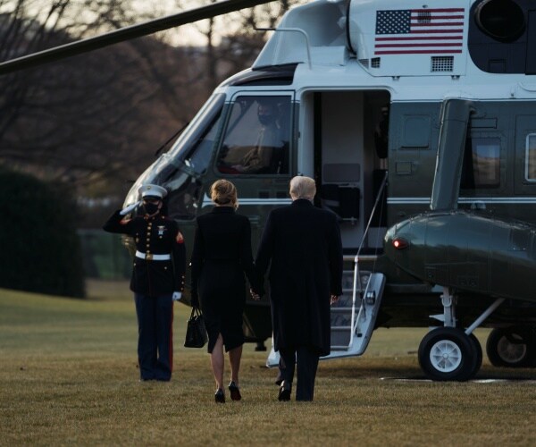 the trumps leave the white house and head into the helicopter