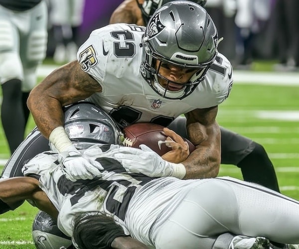 professional football players tackeling