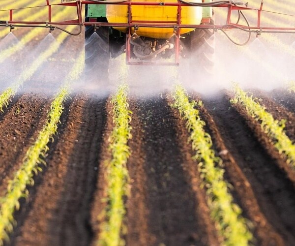pesticides being spread on a farm
