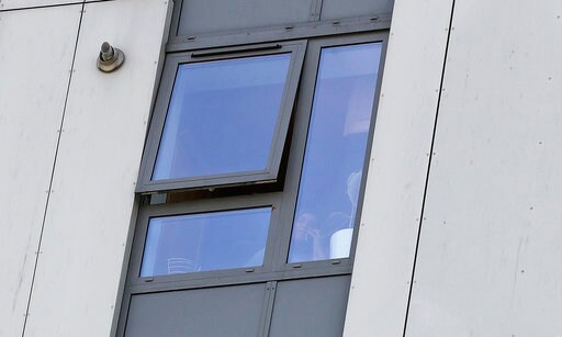 The Latest: May Calls for Major Investigation of Cladding