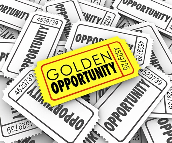 golden opportunity words on a gold or yellow ticket to illustrate great potential and possibility 

