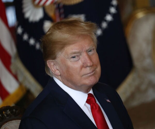 president donald trump attends a christmas eve video teleconference with members of the military